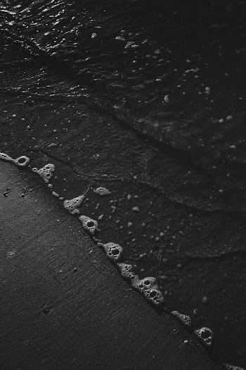 Grayscale Photography of Sea Waves Lapping  on Shore