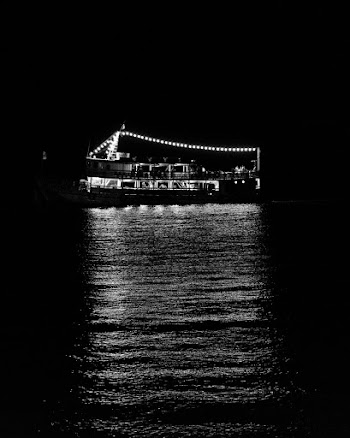 Grayscale Photography of Ship Sailing during Nighttime