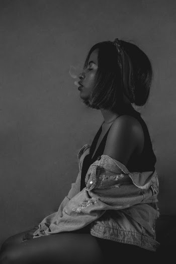 Grayscale Photography of Sitting Woman