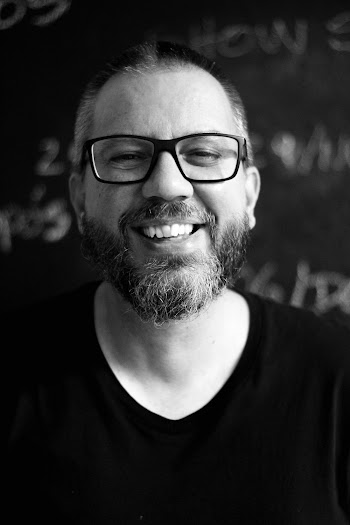 Grayscale Photography of Smiling Man
