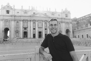 Grayscale Photography of Smiling Man Leaning on Wooden Gate