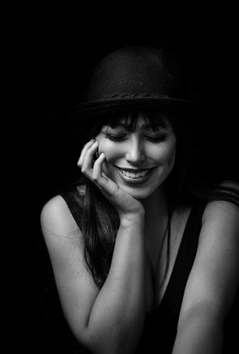 Grayscale Photography of Smiling Woman Putting Hands on Face