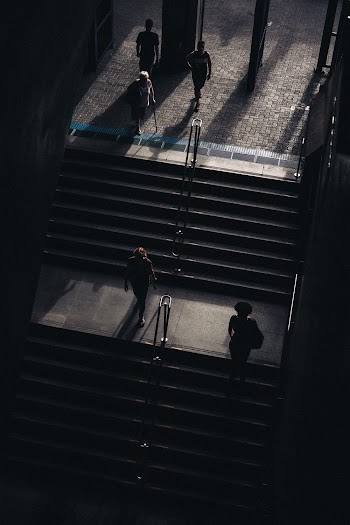 Grayscale Photography of Stairs With People