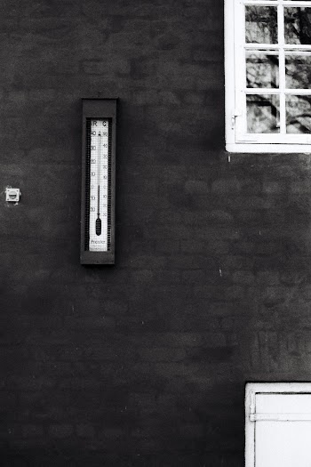 Grayscale Photography of Thermometer on Wall