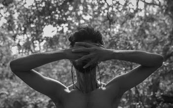 Grayscale Photography of Topless Man Standing While Covering His Face