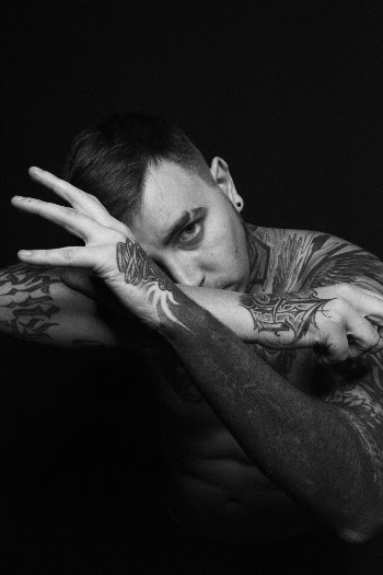 Grayscale Photography of Topless Man With Body Tattoo