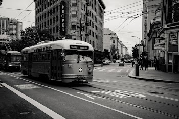 Grayscale Photography of Tram Near Buildings