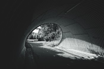Grayscale Photography of Tunnel