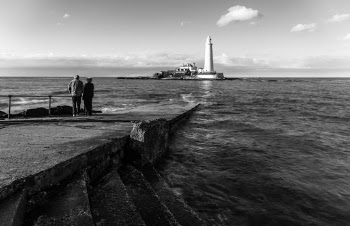 Grayscale Photography of Two People Standing Beside Body of Water