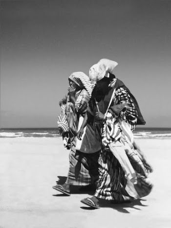 Grayscale Photography of Two Person Near Body of Water