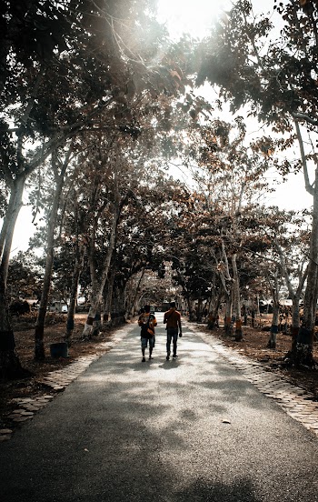 Grayscale Photography of Two Person Walking