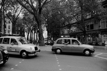 Grayscale Photography of Vehicles Passing Road