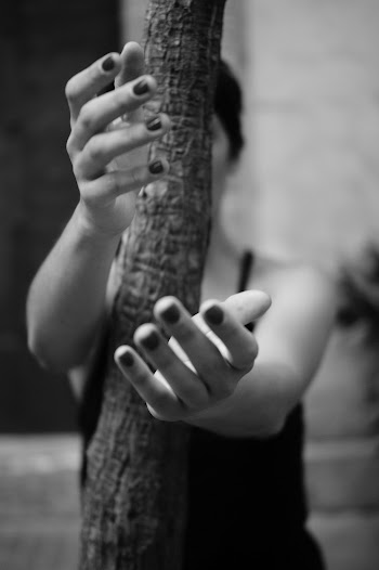 Grayscale Photography of Woman Behind A Trunk