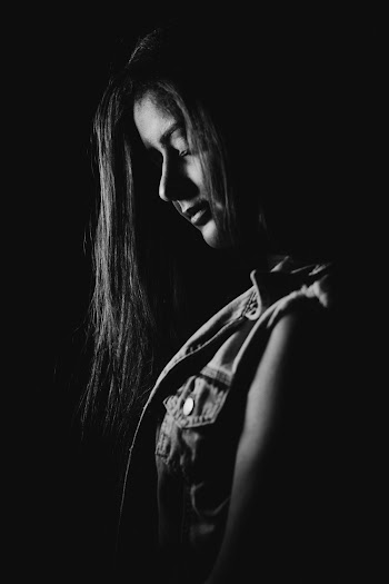 Grayscale Photography of Woman Closing Her Eyes
