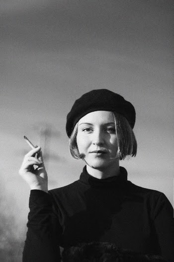 Grayscale Photography of Woman Holding Cigarette