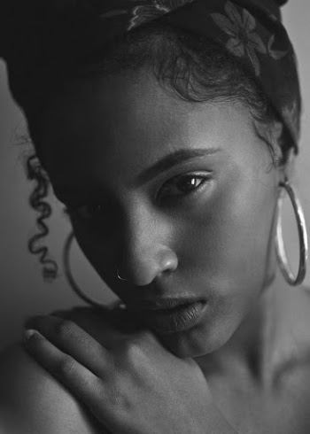 Grayscale Photography Of Woman Holding Her Shoulder