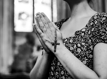 Grayscale Photography of Woman Holding Rosary