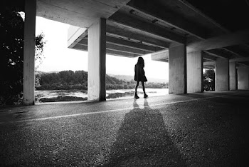 Grayscale Photography of Woman in a Parking Lot