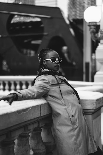 Grayscale Photography Of Woman Leaning On Rail