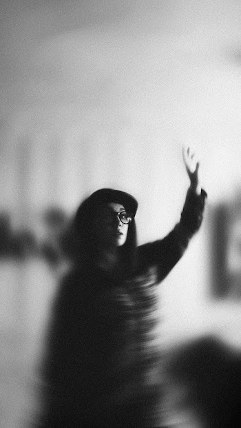 Grayscale Photography of Woman raising her hand