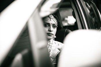 grayscale photography of woman sitting inside car