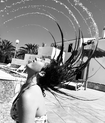 Grayscale Photography of Woman Splashing Hair
