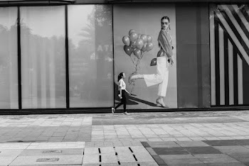 Grayscale Photography of Woman Walking Near Outdoor