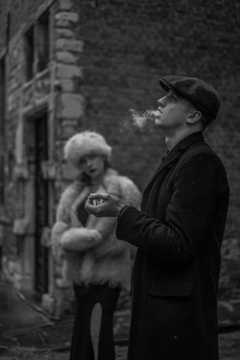 Grayscale Photography of Woman Watching on Smoking Man