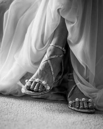 Grayscale Photography Of Woman Wearing Ankle Strap Flat Sandals