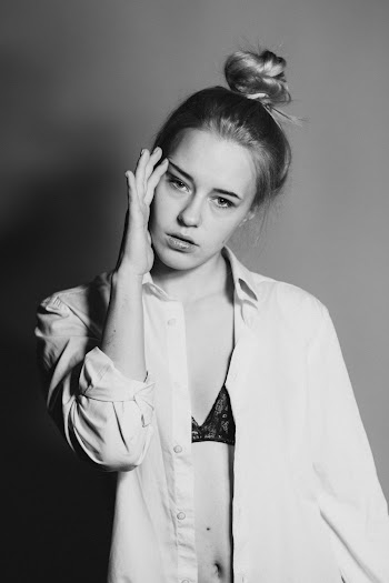 Grayscale Photography of Woman Wearing Dress Shirt and Black Bra