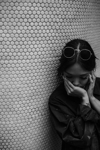 Grayscale Photography of Woman Wearing Jacket and Sunglasses