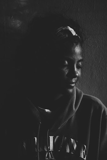 Grayscale Photography of Woman Wearing Pullover Hoodie Standing