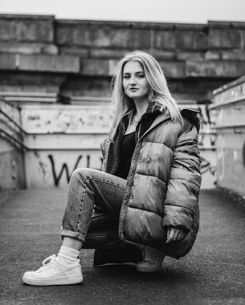 Grayscale Photography of Woman Wearing Zip-up Bubble Jacket