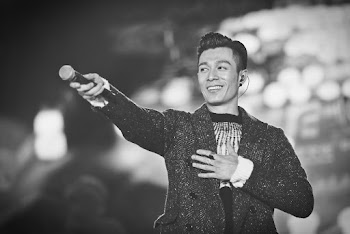 Grayscale Photograpy of Man Holding Microphone