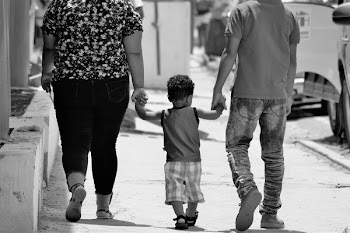 Grayscale Portrait of Man, Woman, and Child Holding Hands