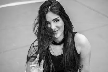 Grayscale Portrait Photo of a Smiling Woman
