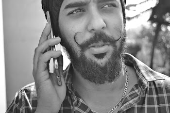 Grayscale Portrait Photo of Man Holding Phone
