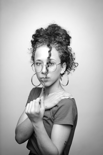 Grayscale Portrait Photography of a Woman Wearing Eyeglasses