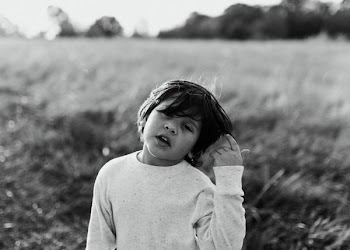 grayscale portrait photography of short-haired child