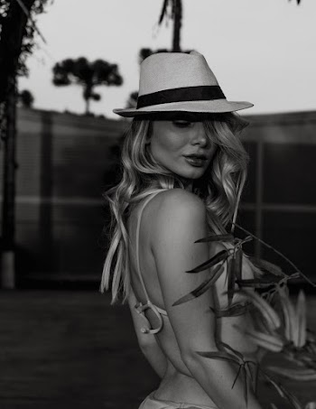 Grayscale Side View Photo of Woman In Hat and Bikini Posing