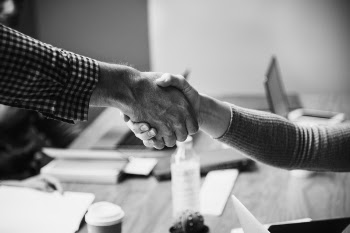 Grayscaled Photo of Handshake