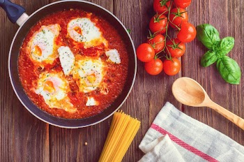 Greek Shakshuka on a Wooden Board 