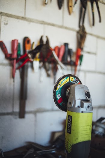 Green and Black Ryobi Angle Grinder