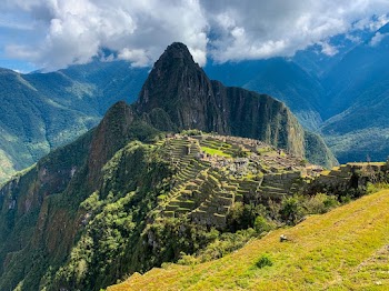Green and Brown Mountain Under White Clouds