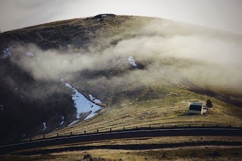 green and brown mountain under white clouds during daytime