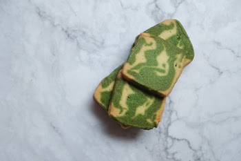 Green and Brown Pastries on White Surface