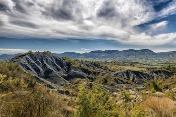 Green and Gray Mountain Under White and Blue Sky