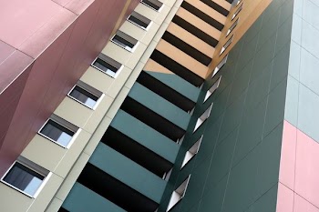 green and pink high rise building