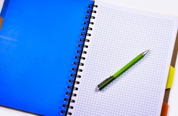 Green and Silver Push Pen on White Ruled Paper Indoors