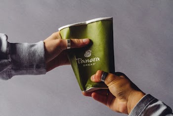 Green and White Disposable Cup
